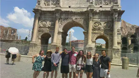 Taylor students standing in front of the Arch of Constantine in Italy