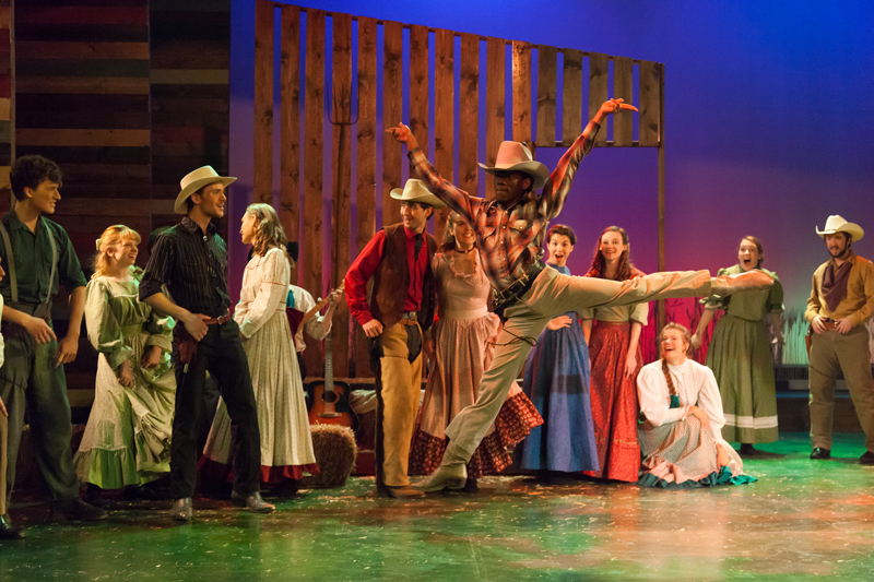 Student dancing during a production of Oklahoma!