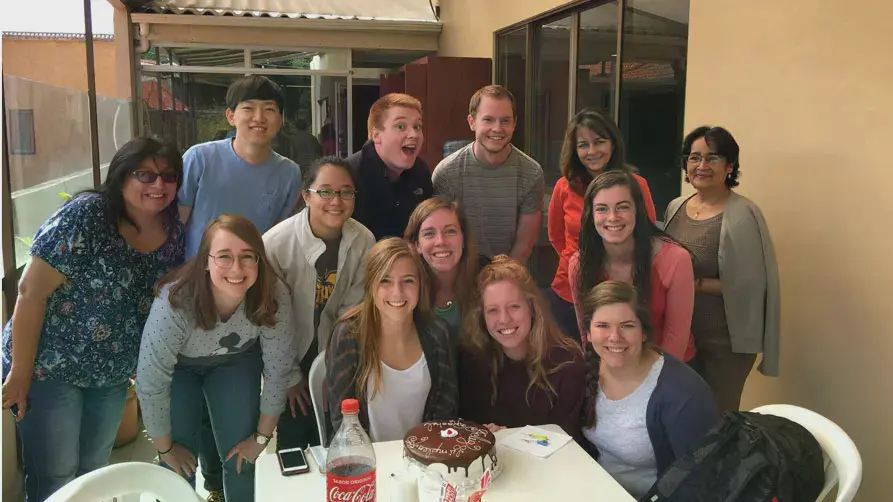 Taylor students celebrating a birthday in South America
