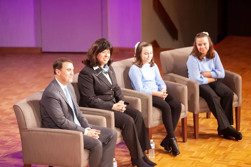 The Lindsay Family sitting onstage in chapel