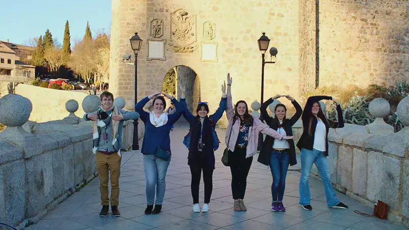 Female students spell out Taylor with their arms on a bridge in Spain