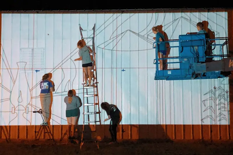 Students painting mural