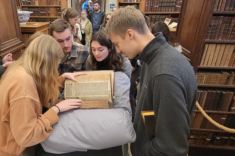 Taylor Students with old Bible
