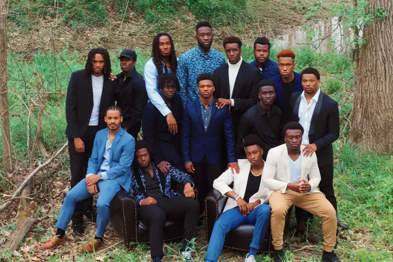 Group of black men wearing suits outdoors