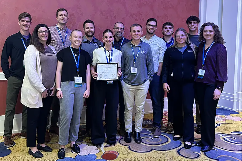 Group of Taylor students and professors at conferene