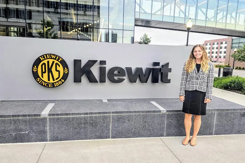 Smith in front of Kiewit headquarters